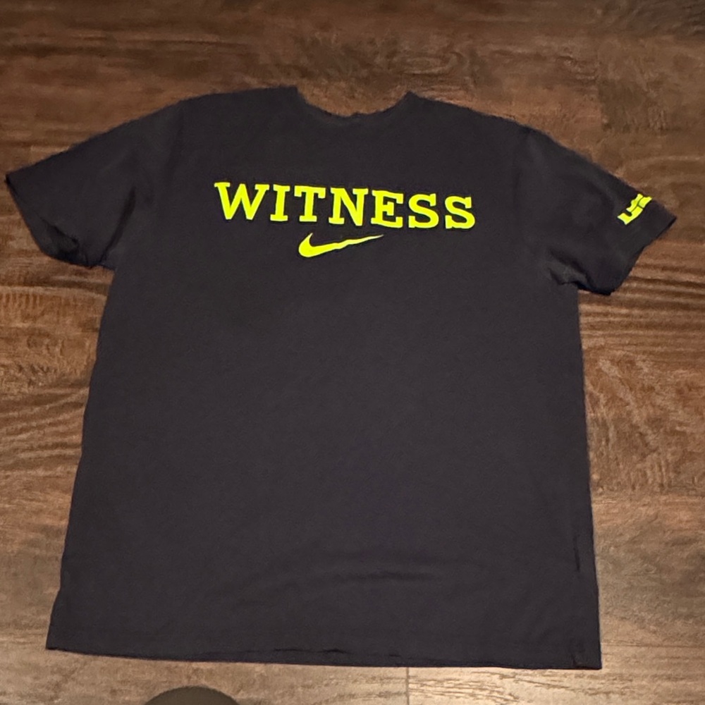 Nike Men's Black Tee with Yellow 'WITNESS' Print